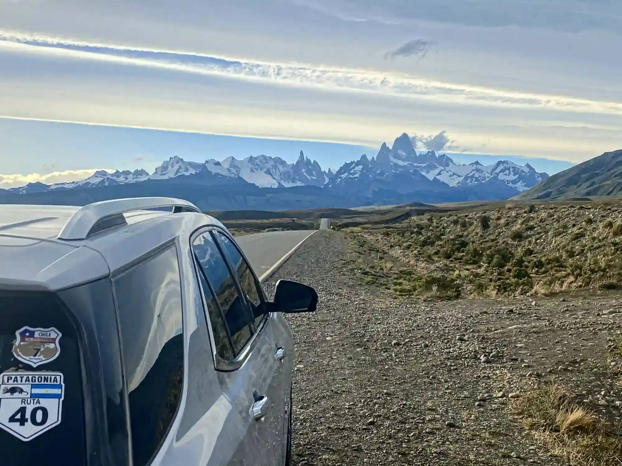 The support vehicle with a Ruta 40 sticker on the road to El Chaltén, the Fitz Roy range ahead